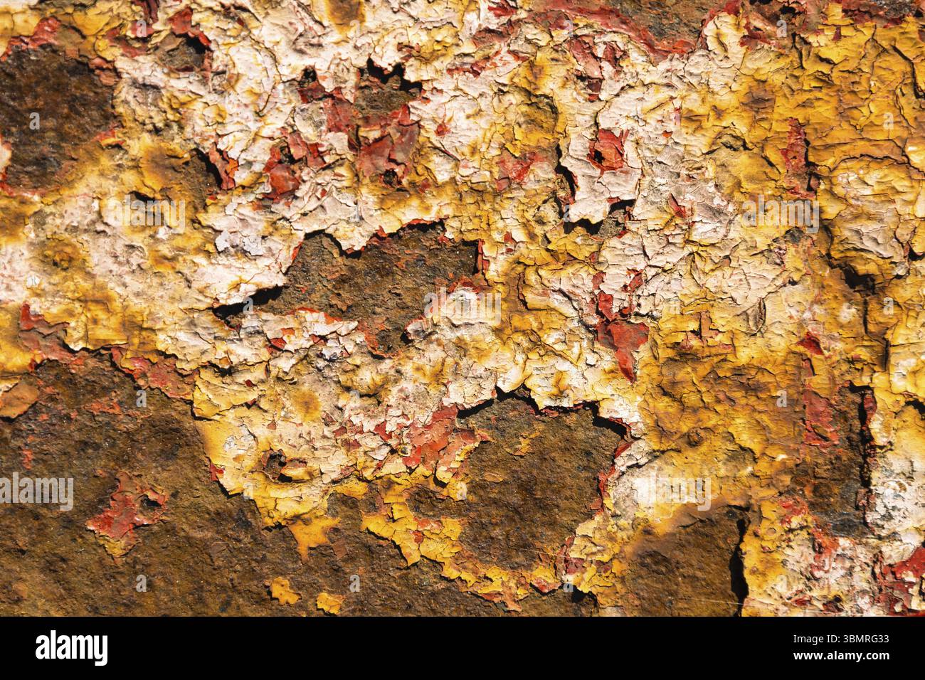 Rusty metal surface with paint flaking and cracking texture Stock Photo