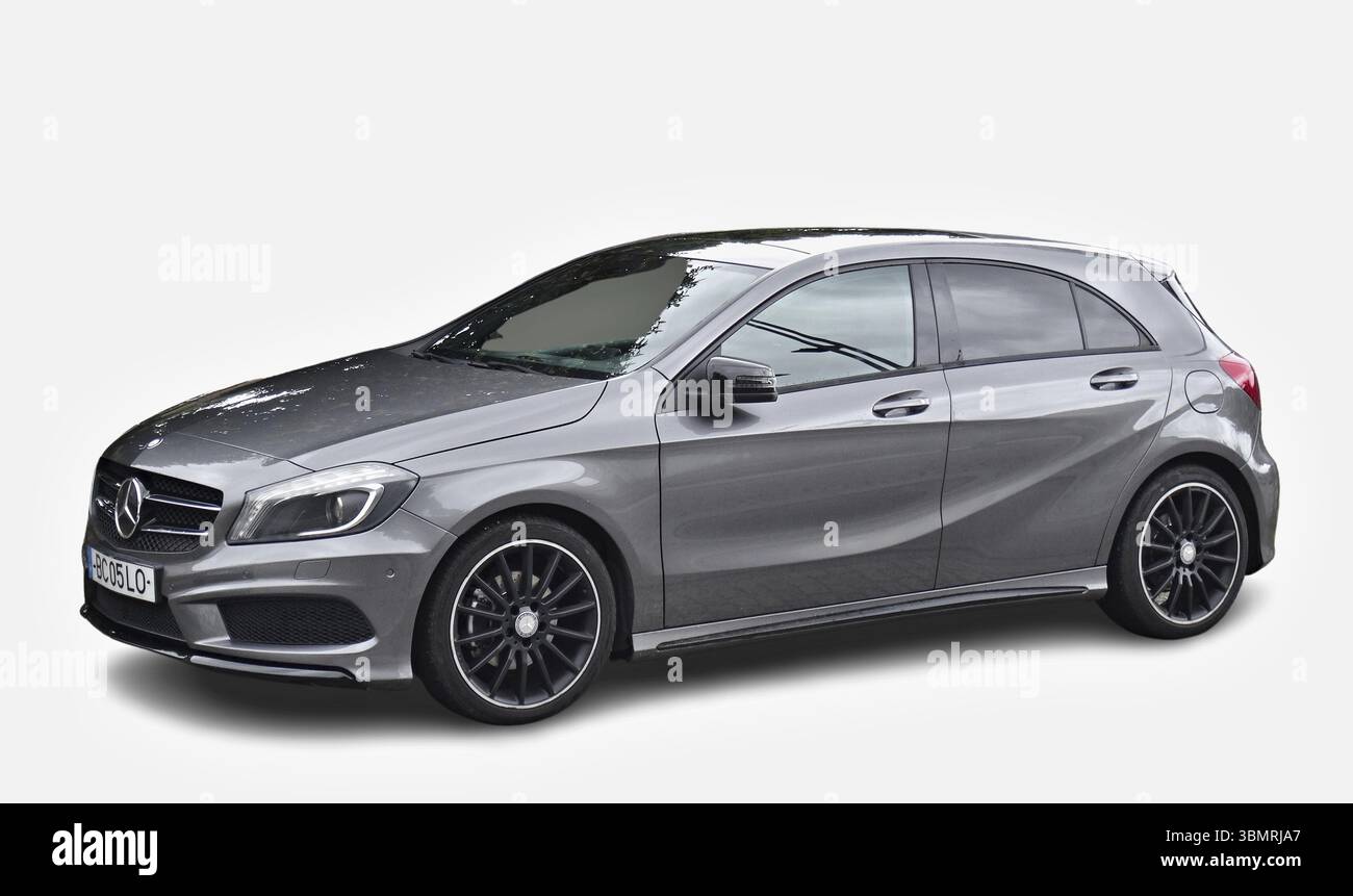 Grey Mercedes-Benz A-Class parked and showing its left side on a white background Stock Photo