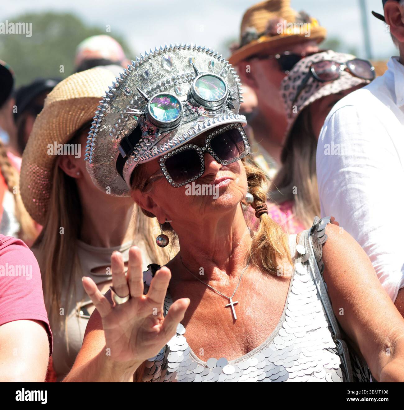 Glastonbury, UK. 28th June, 2025. A music fan watches Brandi Carlile perform on the Pyramid Stage at the 2025 Glastonbury Festival in Glastonbury on Saturday, June 28, 2025. Glastonbury is one of the biggest music festival in the world with over 210,000 people attending. Photo by Hugo Philpott/UPI Credit: UPI/Alamy Live News Stock Photo