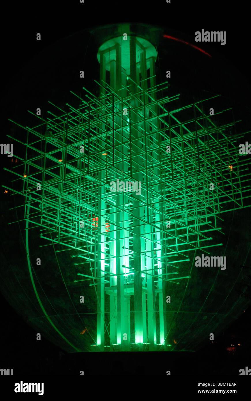 Glowing geometric light installation at night Stock Photo