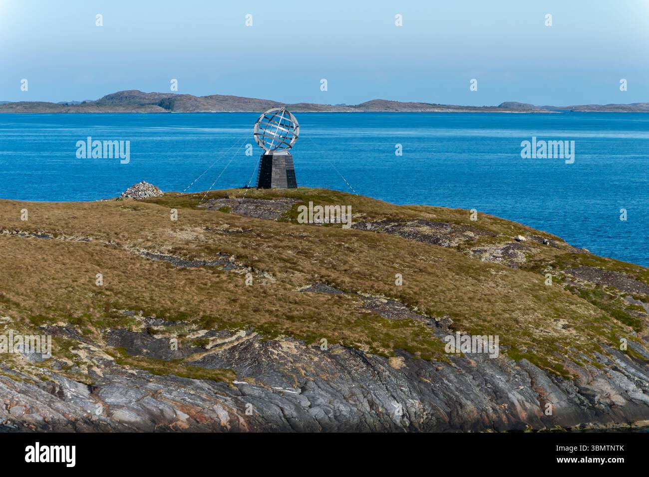 "Crossing the Arctic Circle, marked by a symbolic line located on an island, represents a journey into the polar region. Norway Stock Photo