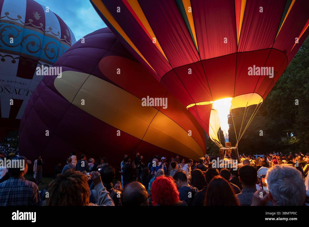 Thousands gather for a Hot Air Balloon Glow at Seattle Center in Seattle on Sunday, June 22, 2025. Stock Photo