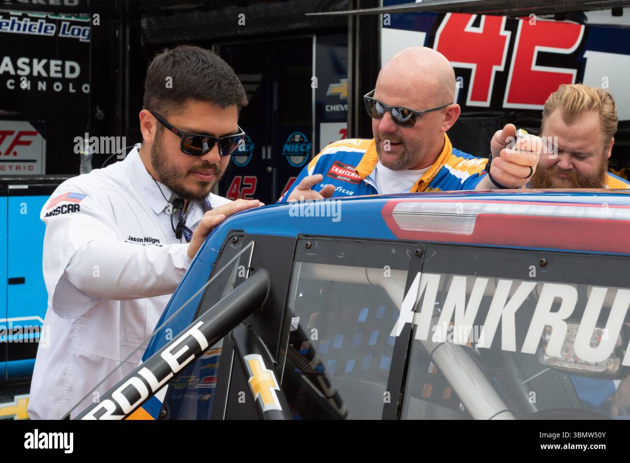 LAKEVILLE, CT - JUNE 27: NASCAR officials check out the #18 McAnally ...