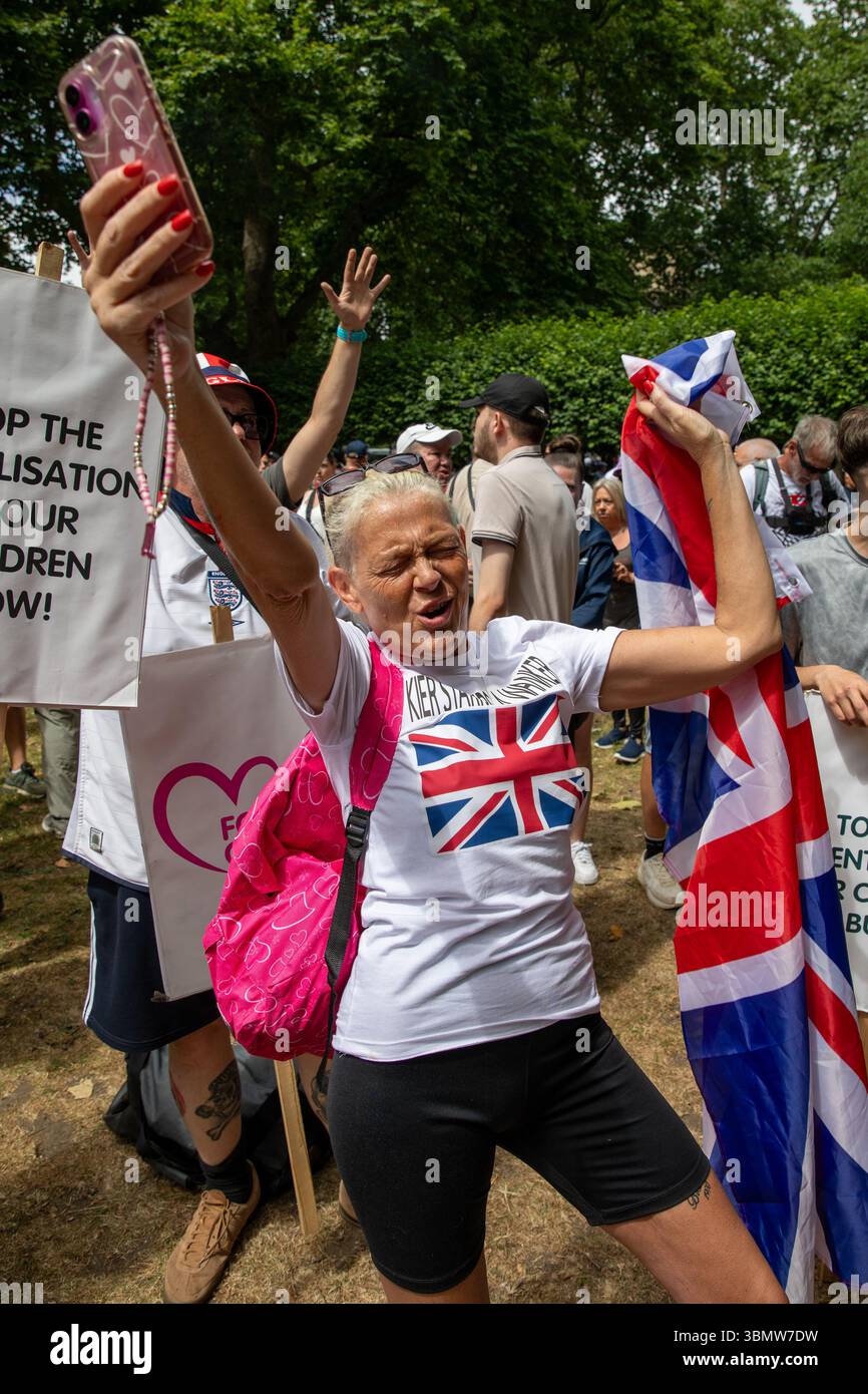 London, UK. 28th June, 2025. A DFLA supporter sings whilst holding her ...