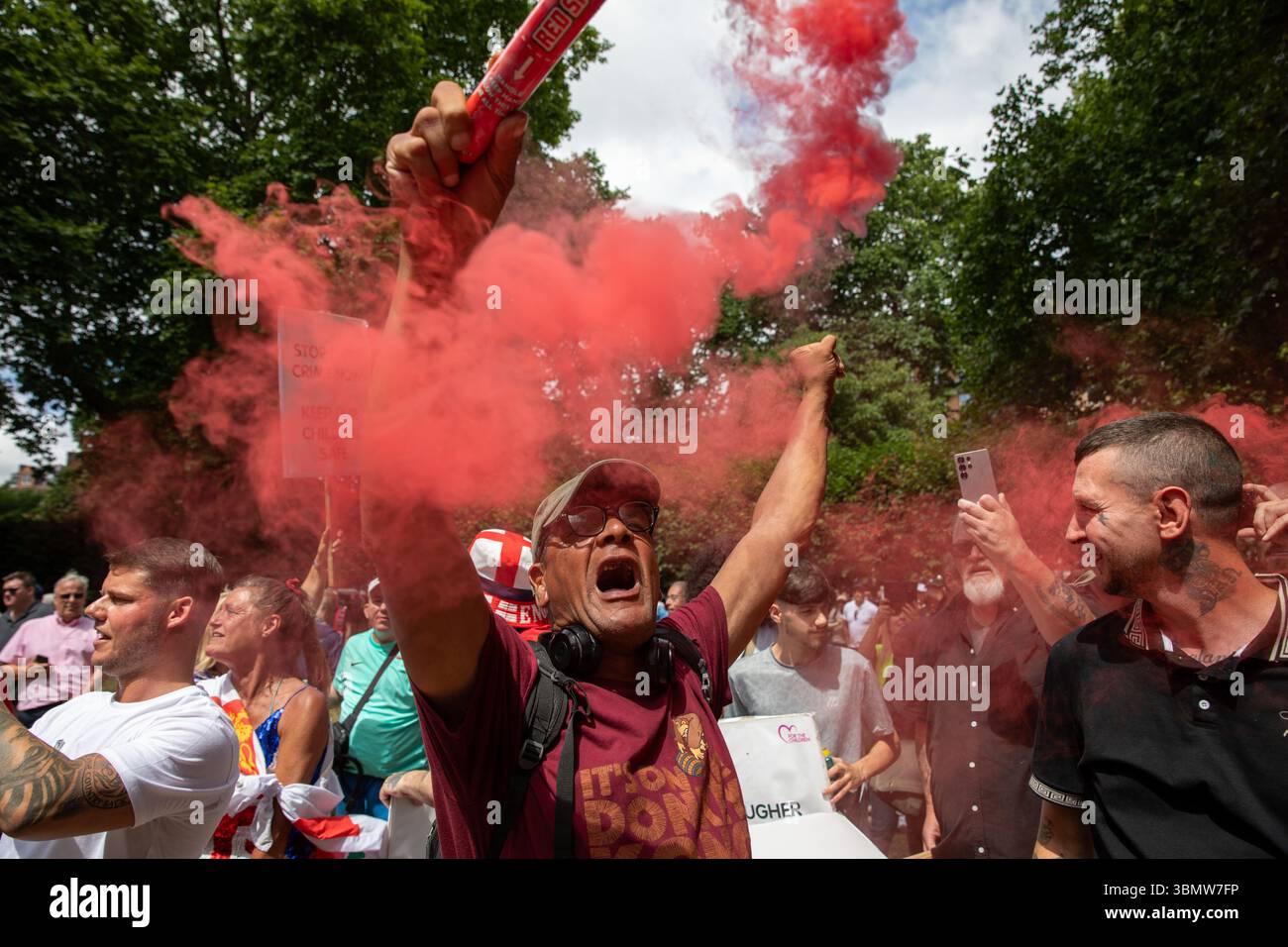 London, UK. 28th June, 2025. A DFLA supporter holds a smoke flare ...