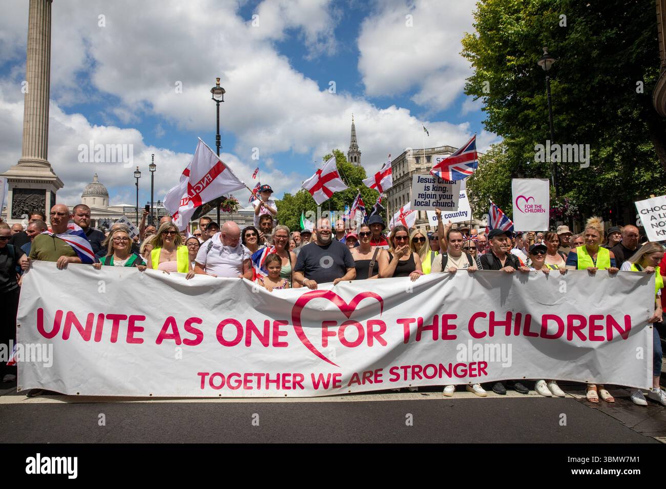 DFLA supporters stand behind a banner during a demonstration. The DFLA ...