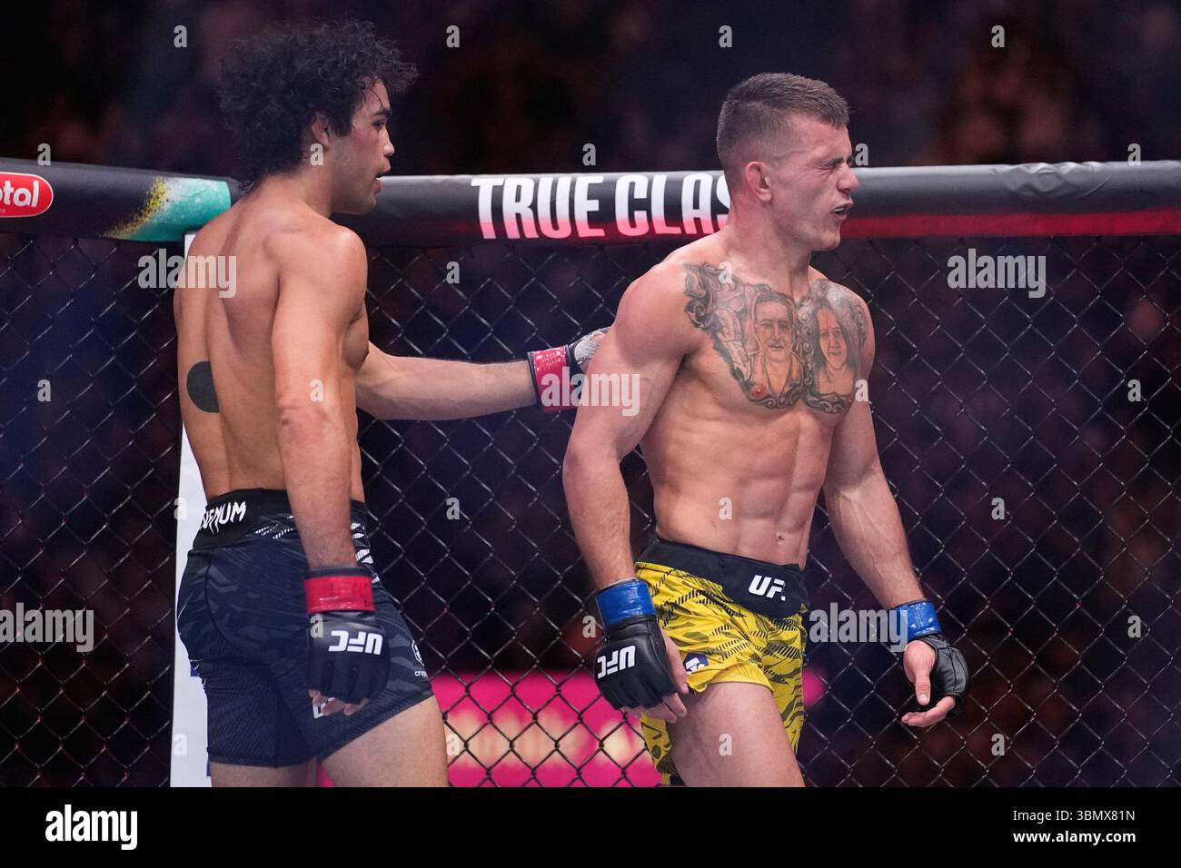 Payton Talbott, left, motions to Felipe Lima after a bantamweight fight