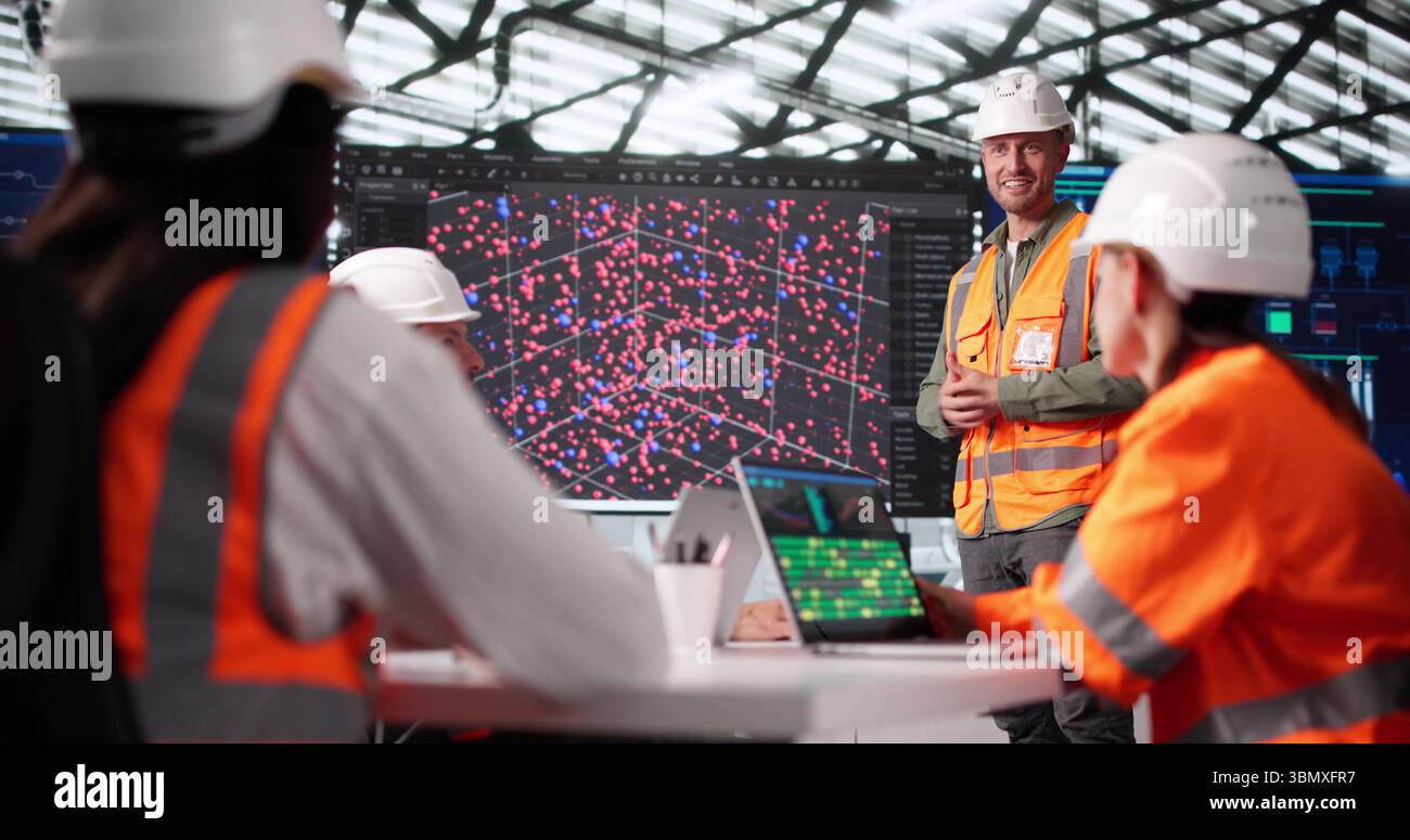 Tech Professor Leading Multiracial Engineer Team In Big Data Instruction Stock Photo