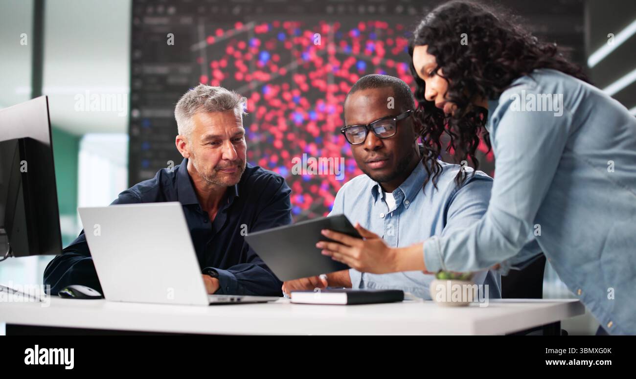 Black Engineer Using Laptop In Professional Cyber Security Team Office Stock Photo