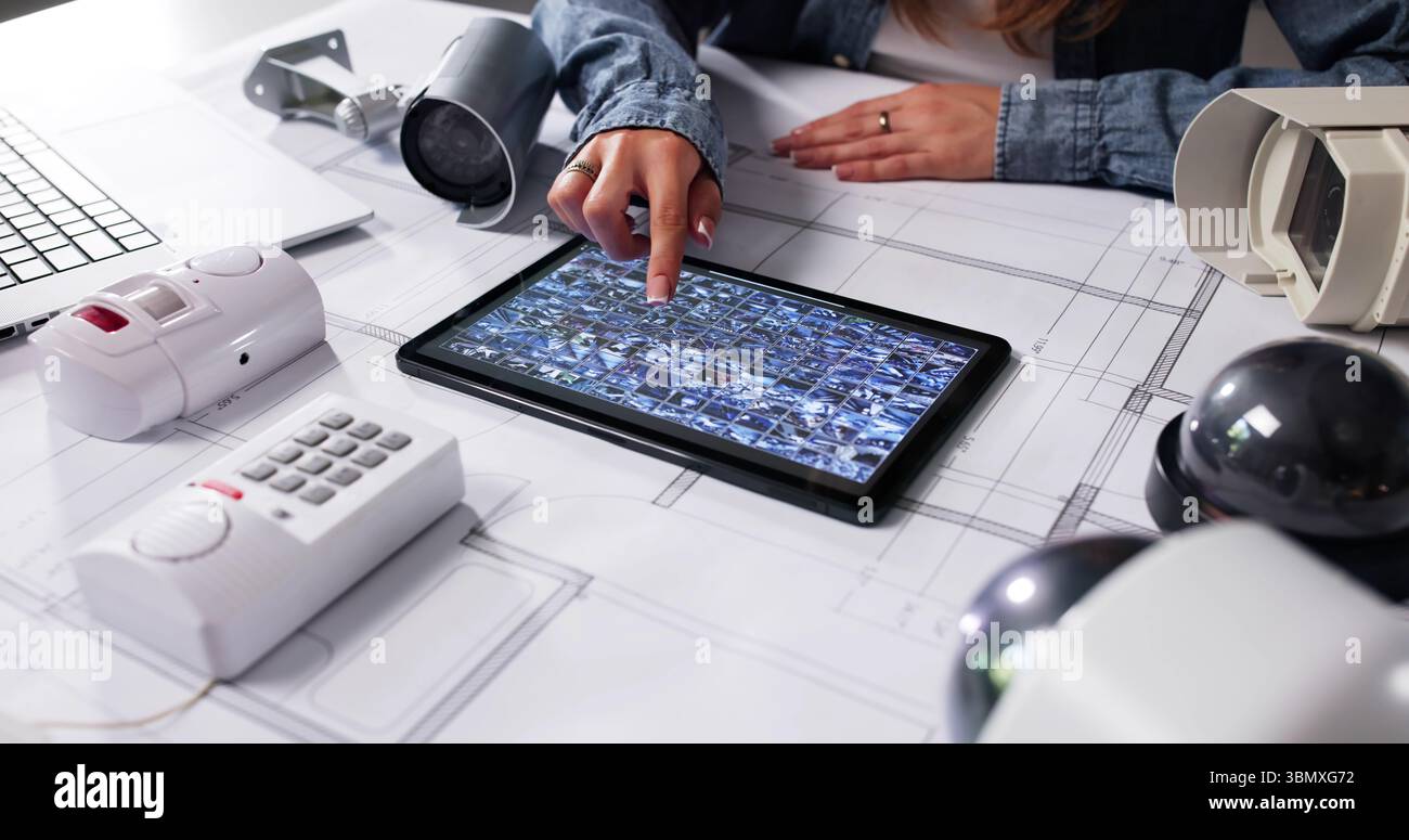 The Female Architect Is Using A High-tech Security Camera System Stock ...
