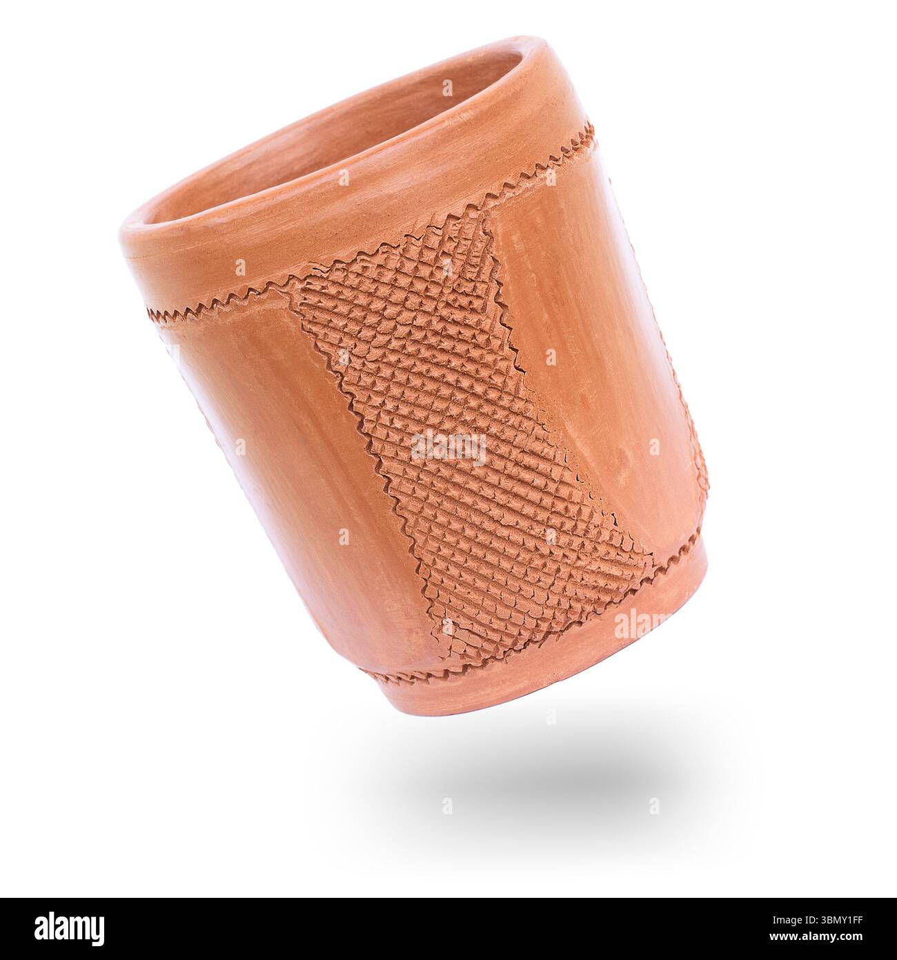 It is Clay cup isolated on white. Stock Photo
