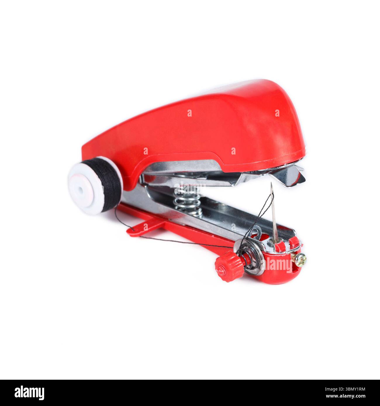 It is Red handheld sewing machine isolated on white. Stock Photo