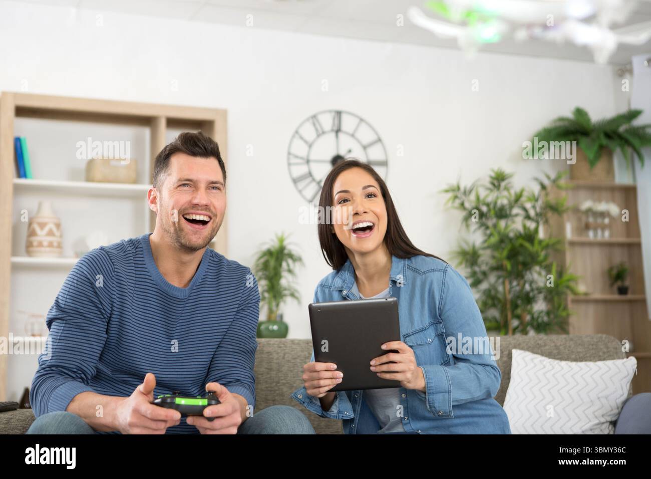 happy couple using modern drone Stock Photo