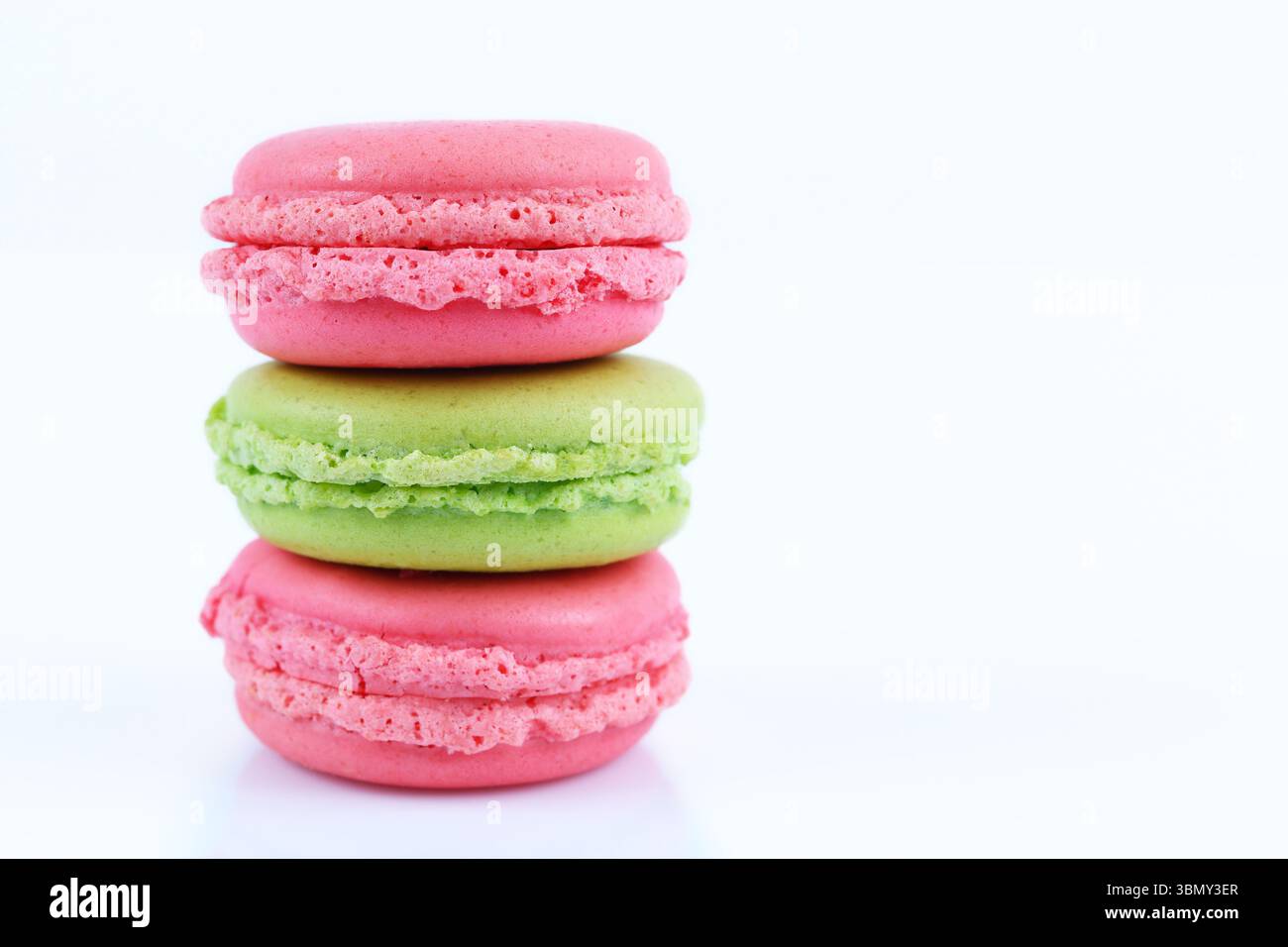 It is Three macaroons isolated on white. Stock Photo