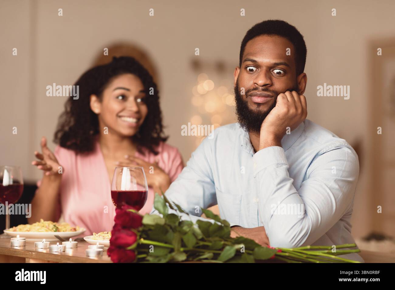 Black Man On Unsuccessful First Date In Restaurant Stock Photo