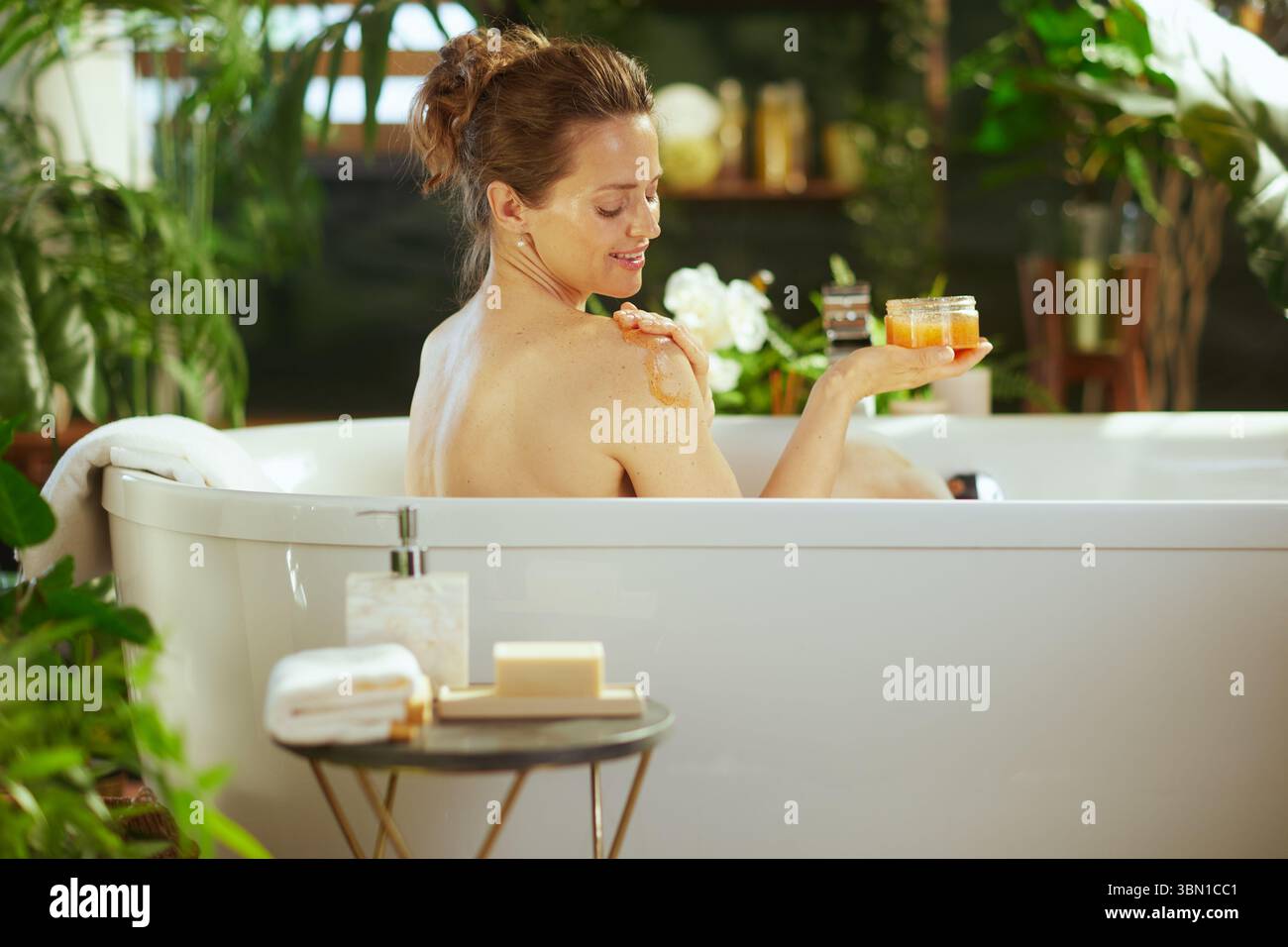 Woman seen from back applies hi-res stock photography and images - Alamy