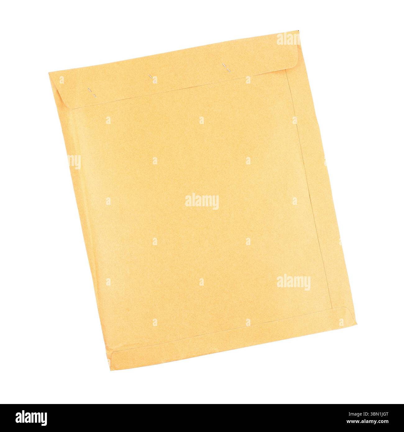 it is close brown envelope by staples isolated on white. Stock Photo