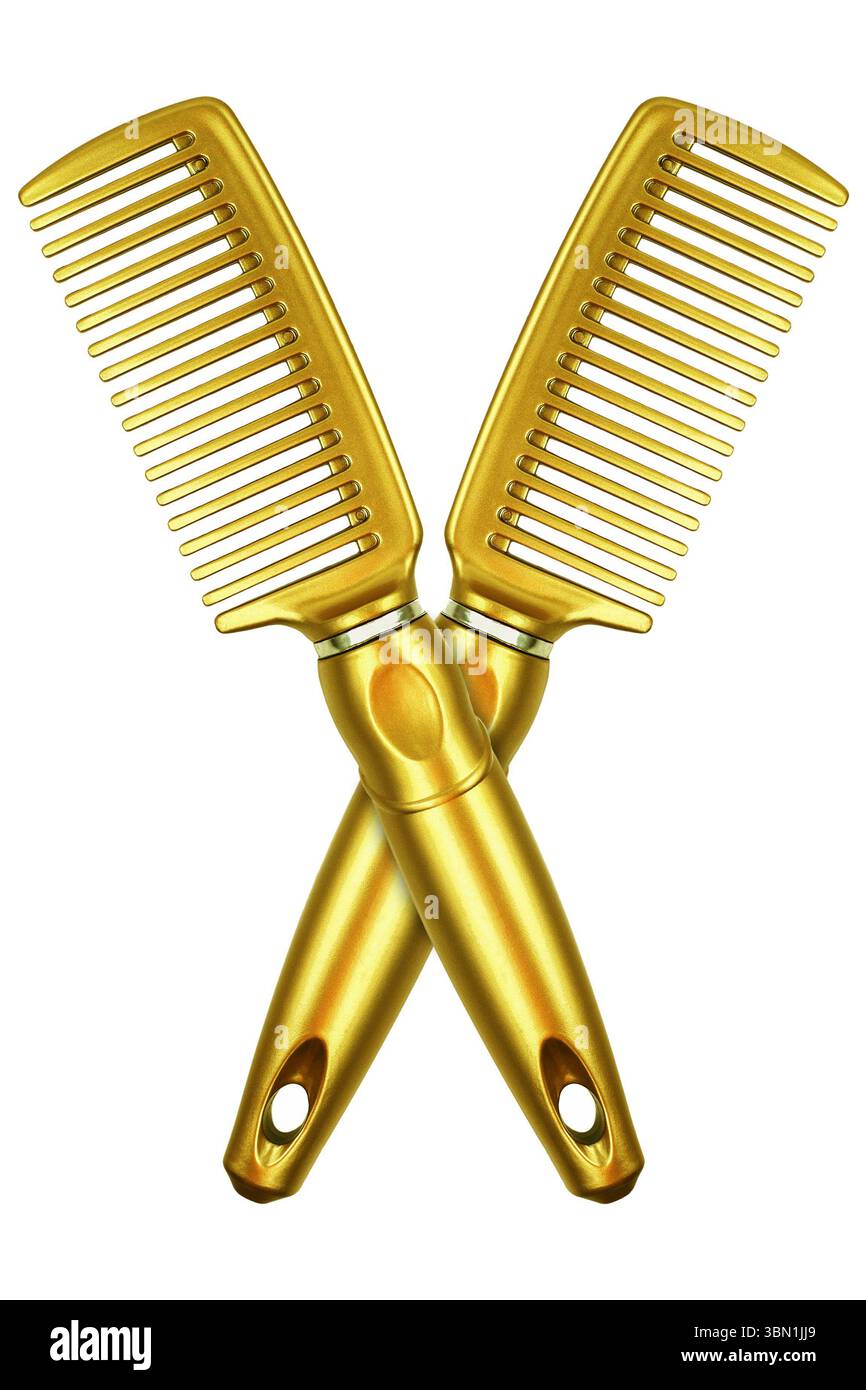 it is two gold combs isolated on white. Stock Photo