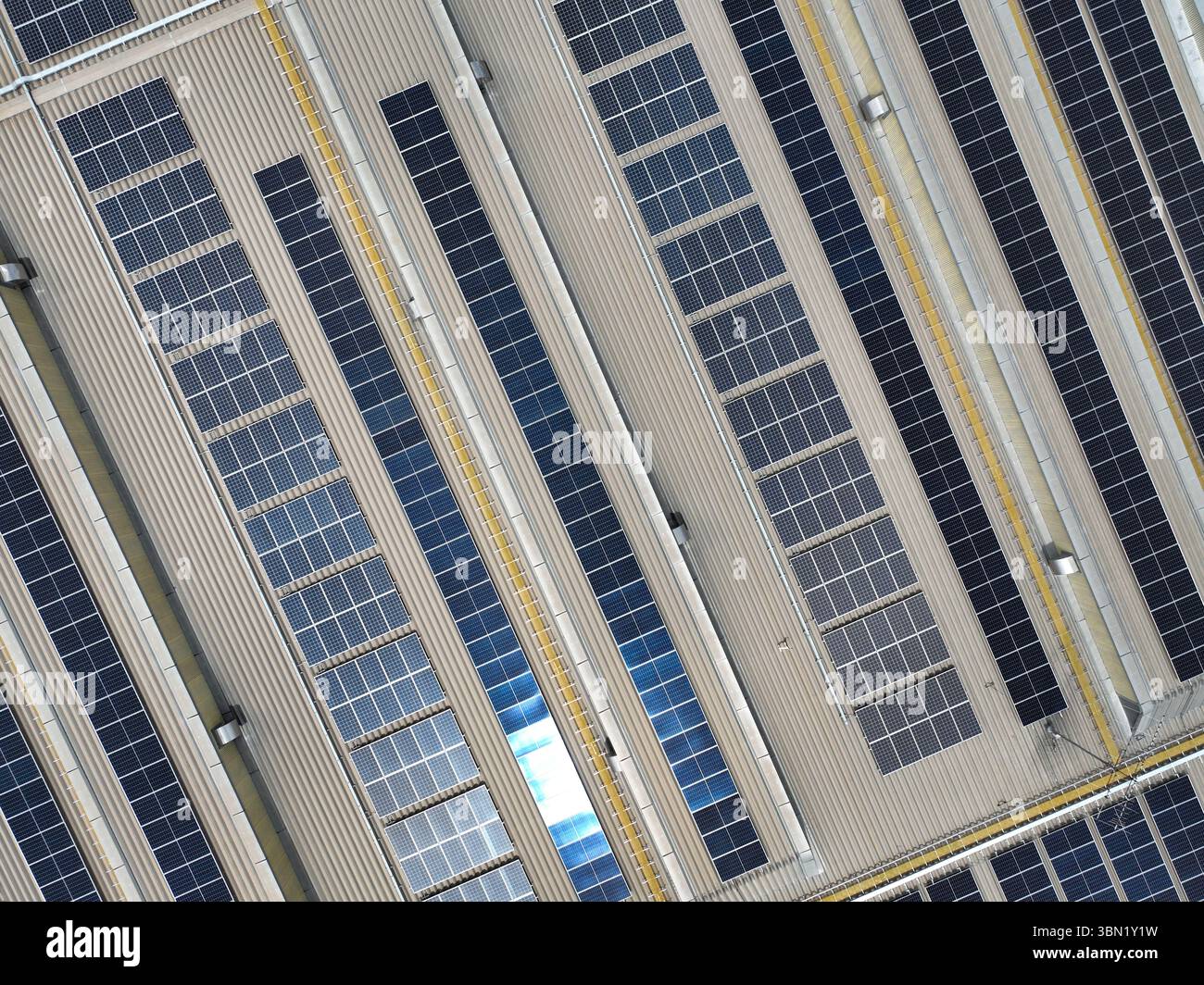 Solar-powered warehouse facility. Modern distribution center with ...