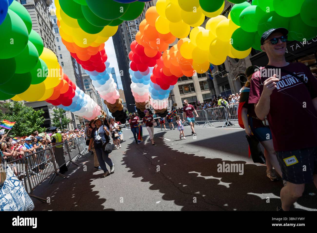 NEW YORK, NEW YORK JUNE 29 People with balloons in rainbow flag