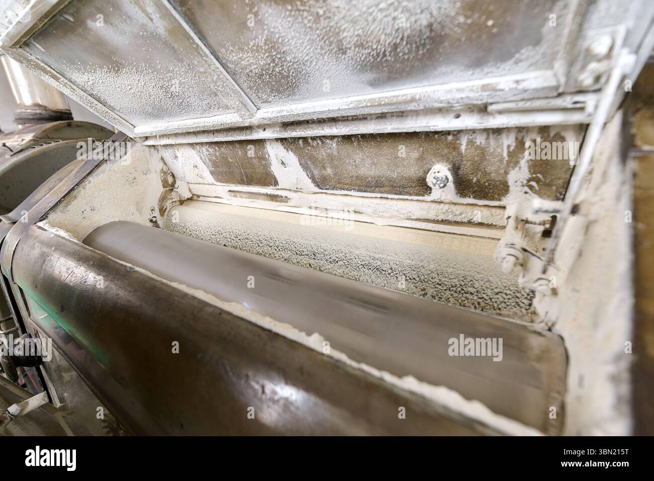 Flour milling process inside a roller mill machine revealing finely ...