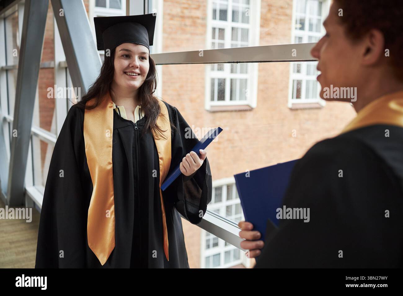 Graduate wearing academic gown hi-res stock photography and images - Alamy
