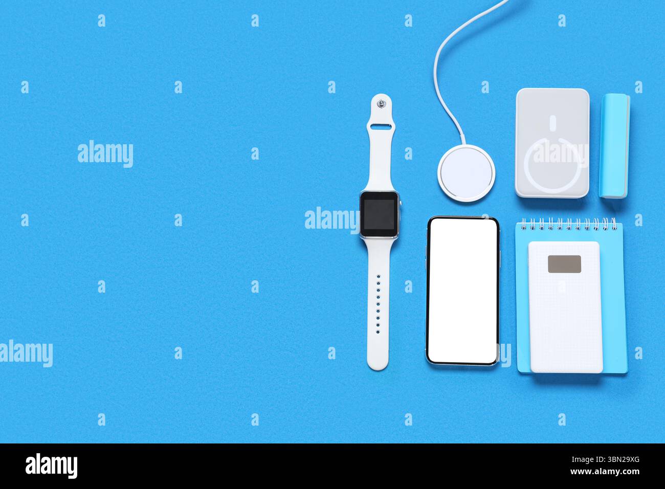 Composition with different modern gadgets and notebook on color background Stock Photo