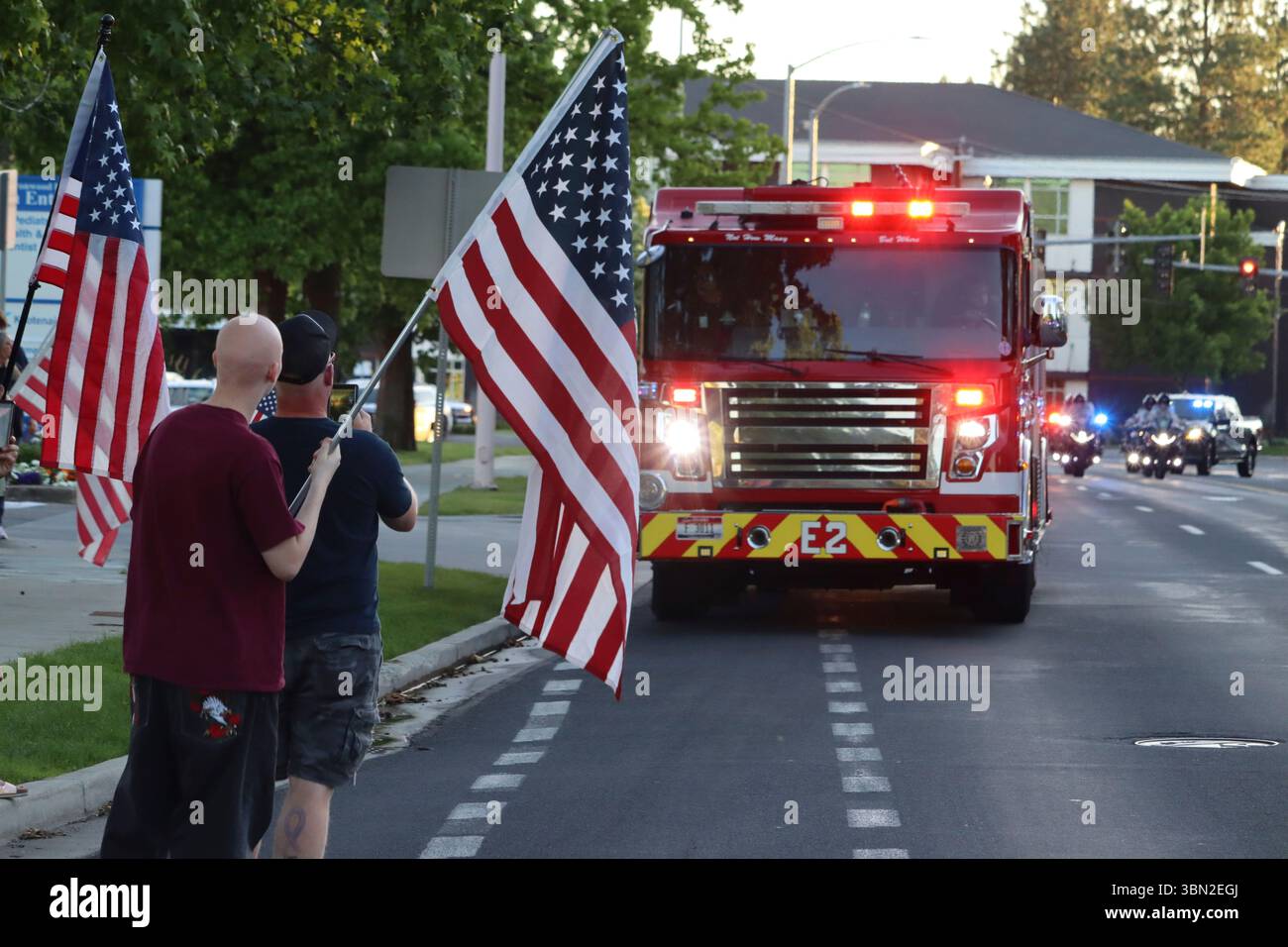 A procession from Kootenai Health heads to the medical examiner's office in Spokane, Wash., after firefighters were killed Sunday, June 29, 2025, when they were ambushed by a sniper while responding to a blaze near Coeur d’Alene, Idaho. (Bill Buley/Coeur D'Alene Press via AP) Stock Photo