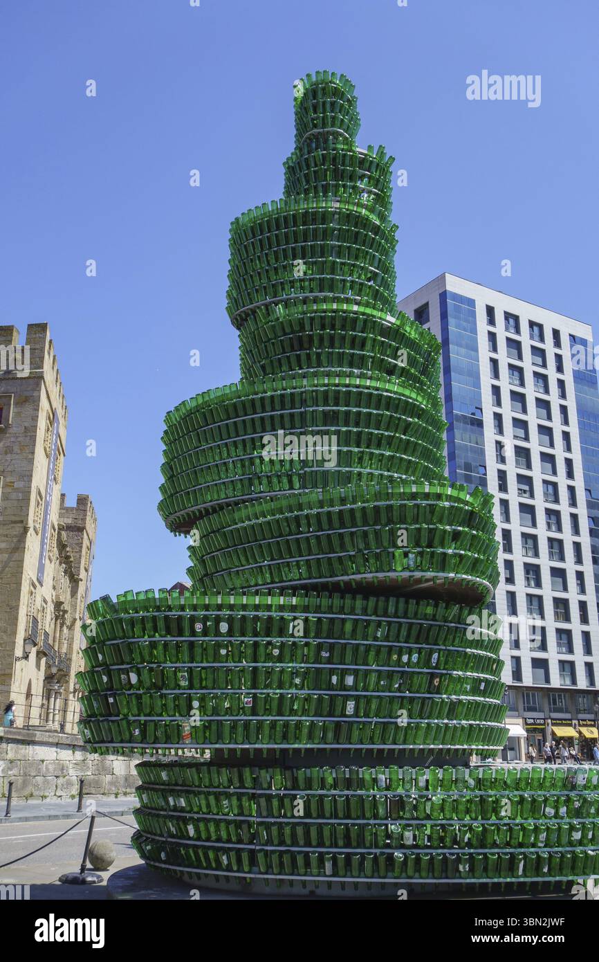 Picture Idea: Modern Green Sculpture Made Of Bottles In Front Of An