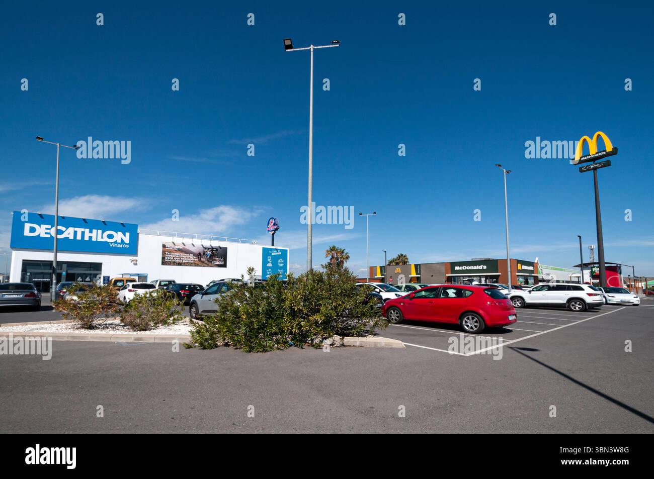 McDonald's restaurant sign and Decathlon store in Portal Mediterrani commercial center, Vinaròs, Castellón, Spain Stock Photo