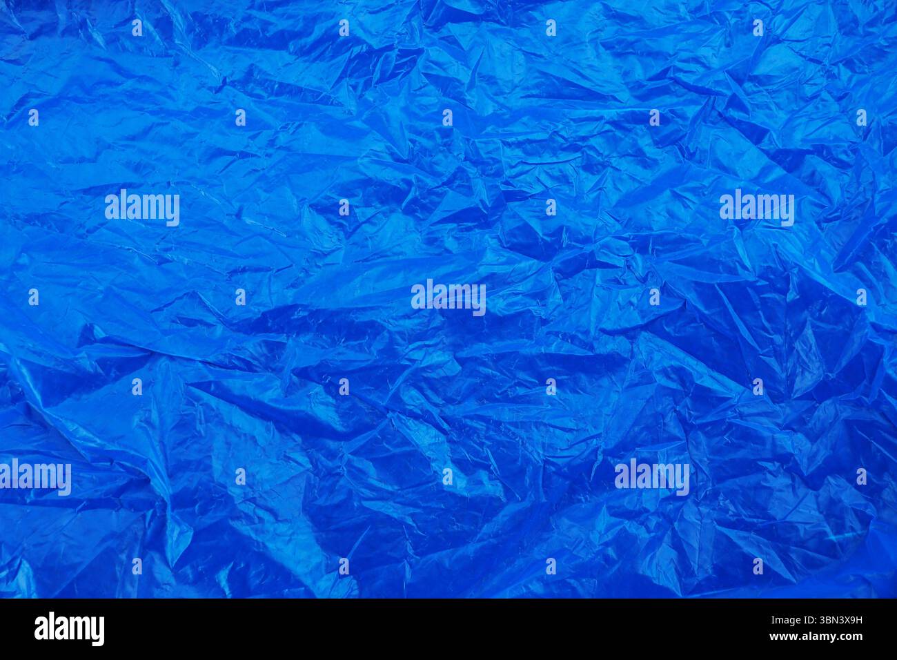 blue wrinkled plastic texture background. Stock Photo