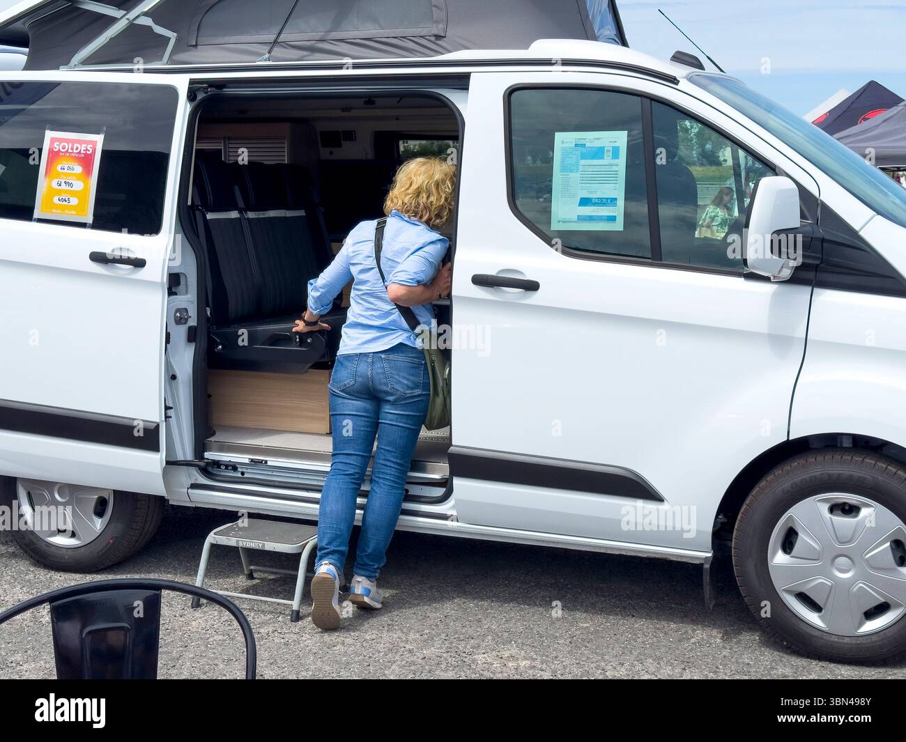 Salon on the theme of Vanlife. Exhibition of converted vehicles.. Vehicle equipped with a roof tent Stock Photo