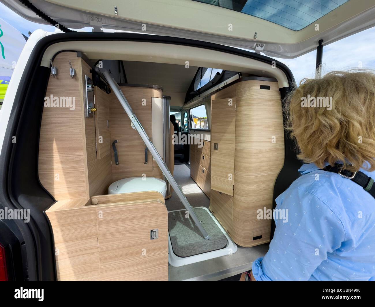 Salon on the theme of Vanlife. Exhibition of converted vehicles.. Vehicle equipped with a roof tent Stock Photo