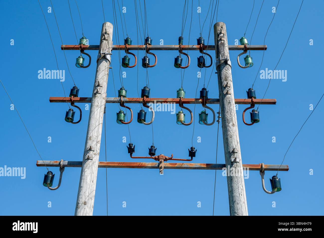 Power line pole with glass insulators Stock Photo