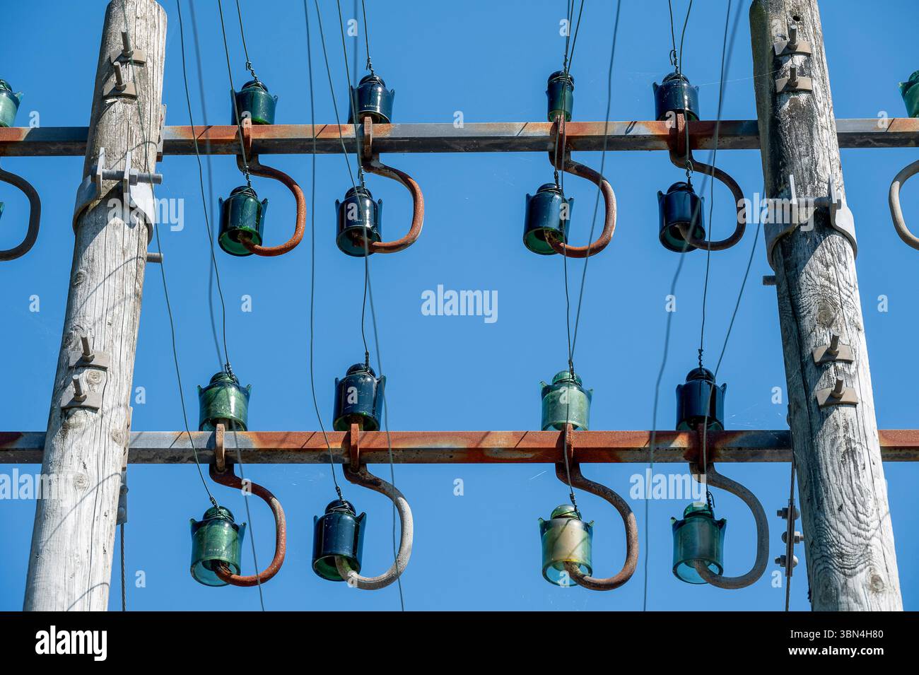 Power line pole with glass insulators Stock Photo