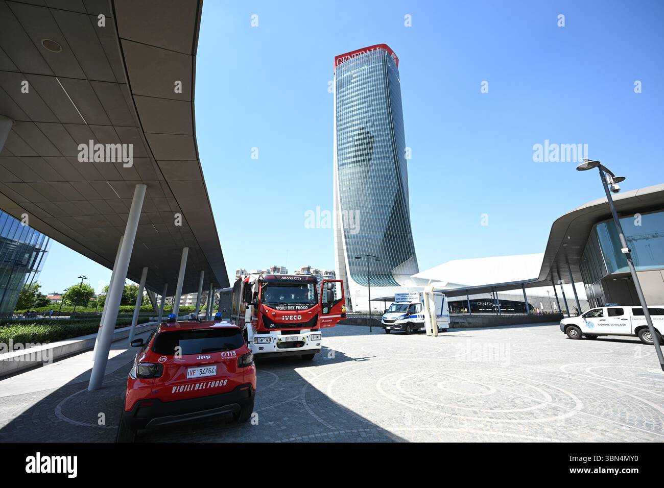 Milan, Italy. 30th June, 2025. Firefighters vehicles are seen under ...