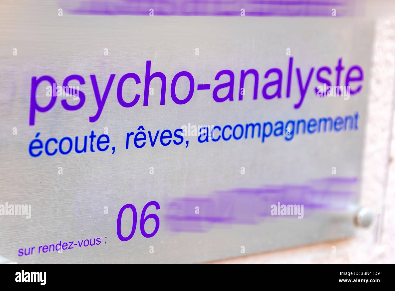 Plate of a psychoanalyst. Listening, dreaming, accompanying Stock Photo