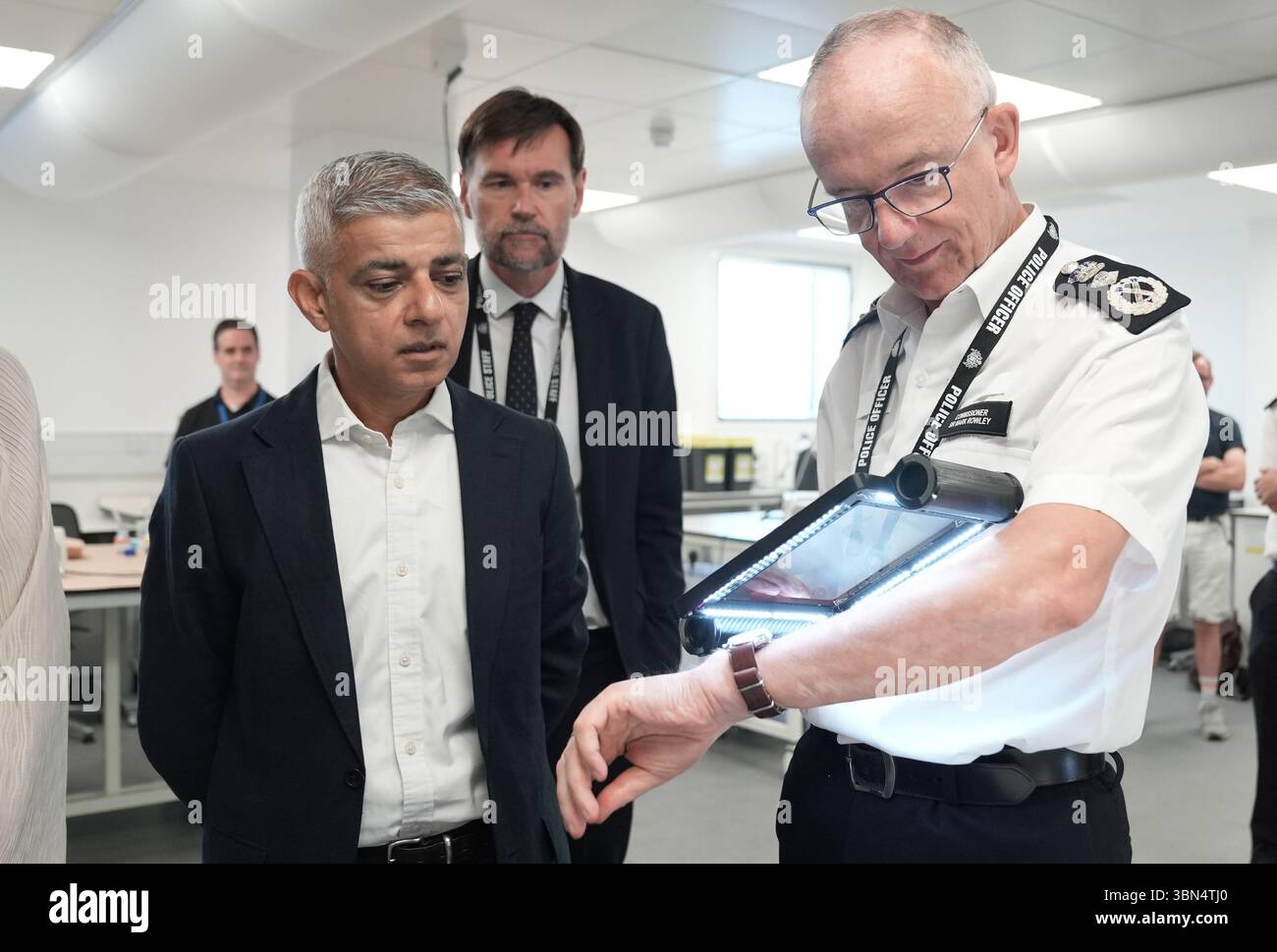 Mayor of London Sir Sadiq Khan (left) and Metropolitan Police ...