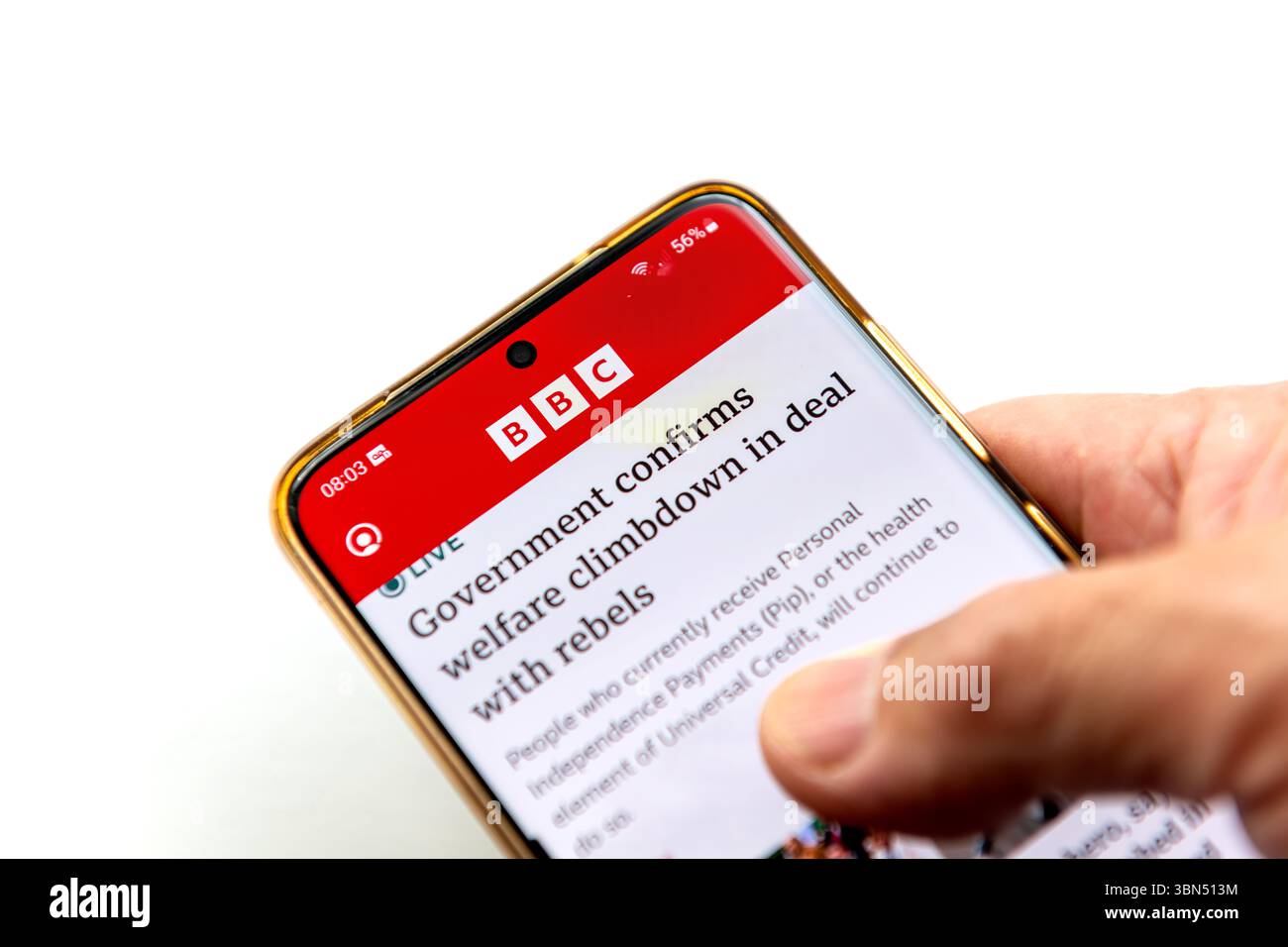 London. UK- 06.27.2025. A person holding a smartphone with the BBC News application on the screen isolated on white. Stock Photo