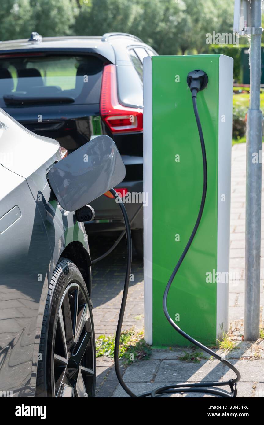 Electric Vehicle Charging Station Solutions in a Modern Urban Setting with Enhanced Accessibility Stock Photo