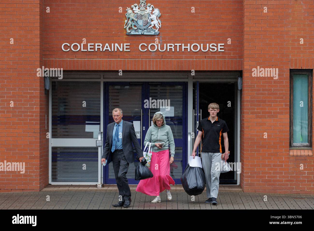 Issac Adams (right) leaves Coleraine Magistrates' Court with his parents, where he was charged in connection to an incident in which slurry was sprayed in Ballymena hours before the town hosted its first Pride parade. Picture date: Monday June 30, 2025. Stock Photo
