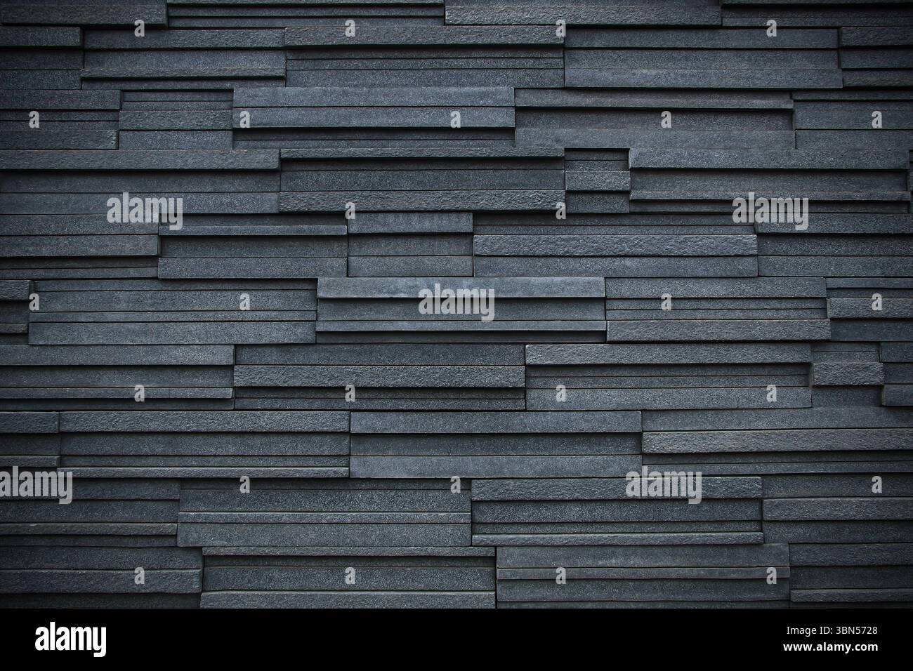 dark black modern brick wall for pattern and background. Stock Photo