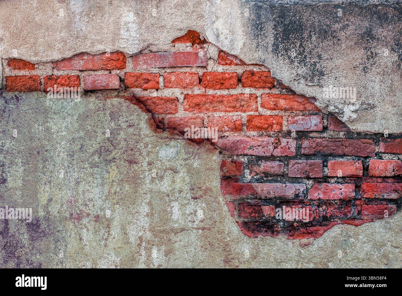 old brick wall with damaged concrete for background. Stock Photo