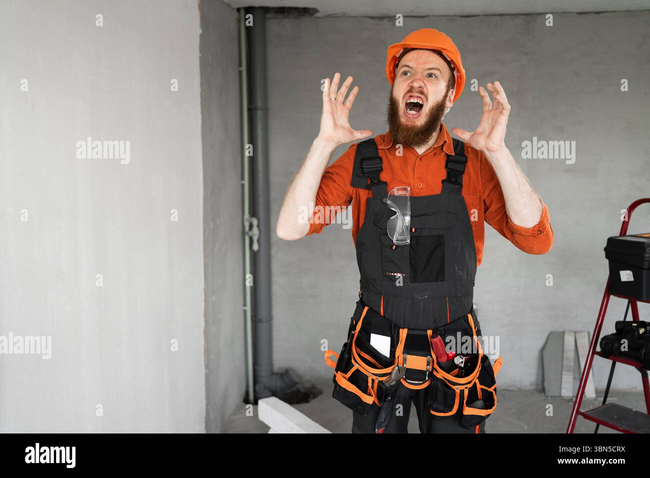 annoyed angry builder or architect in furious gesture with his hands in ...