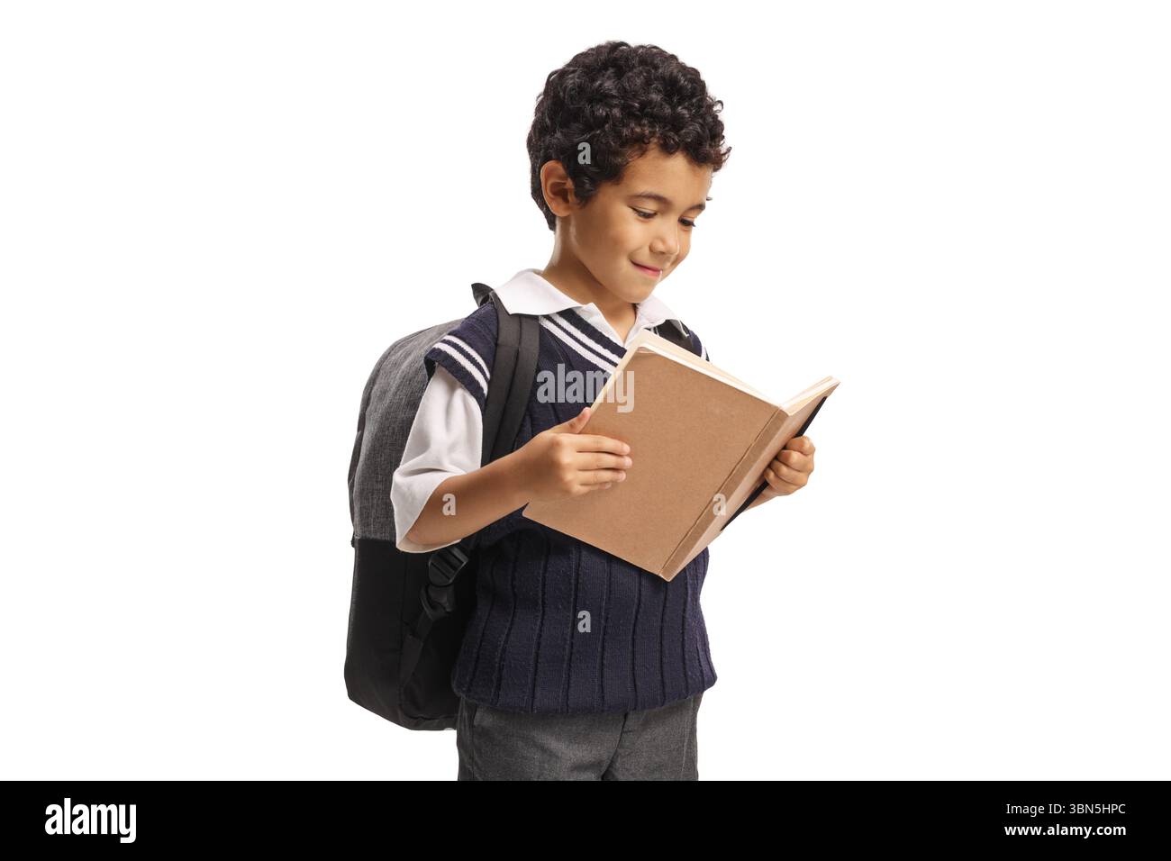 Asian schoolboy reading a book isolated on white background Stock Photo ...