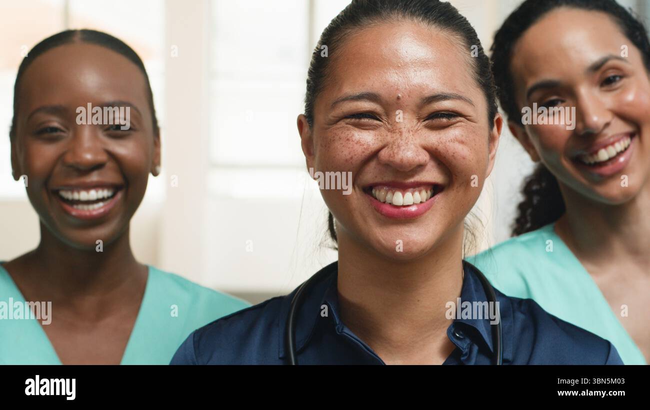 Friendly Smiling Medical Professionals United in a Group Setting Stock Photo