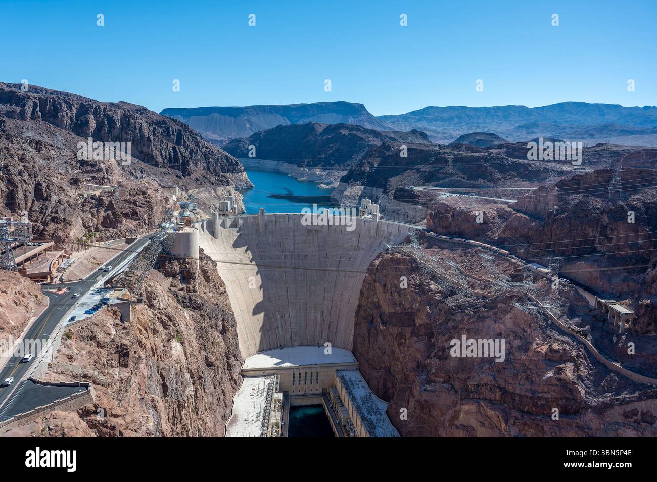 Panoramic view of Hoover Dam under clear desert skies, capturing the ...
