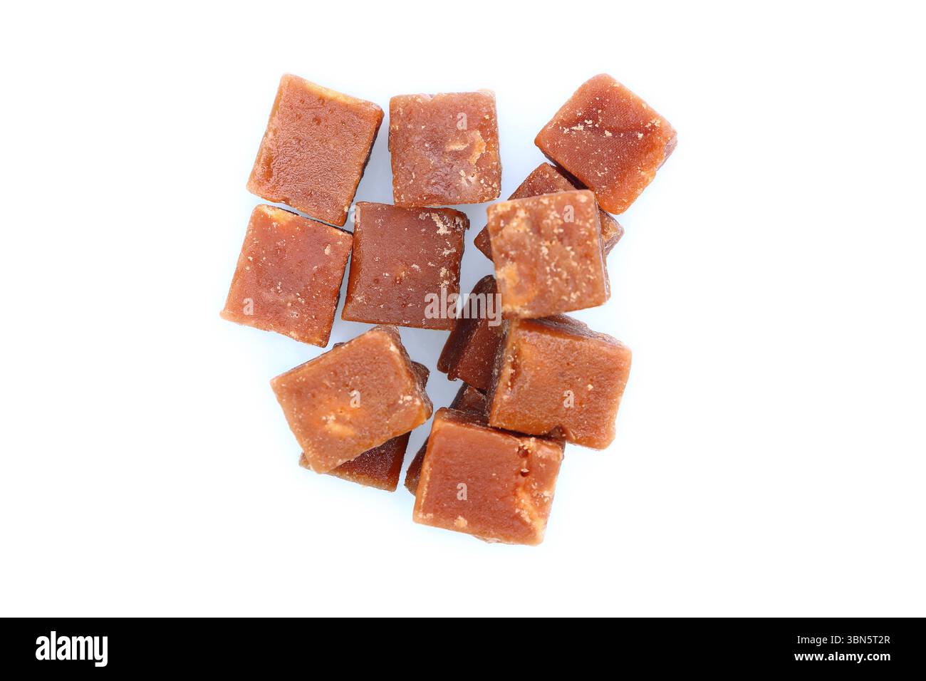 brown sugarcane cubes on white background. Stock Photo