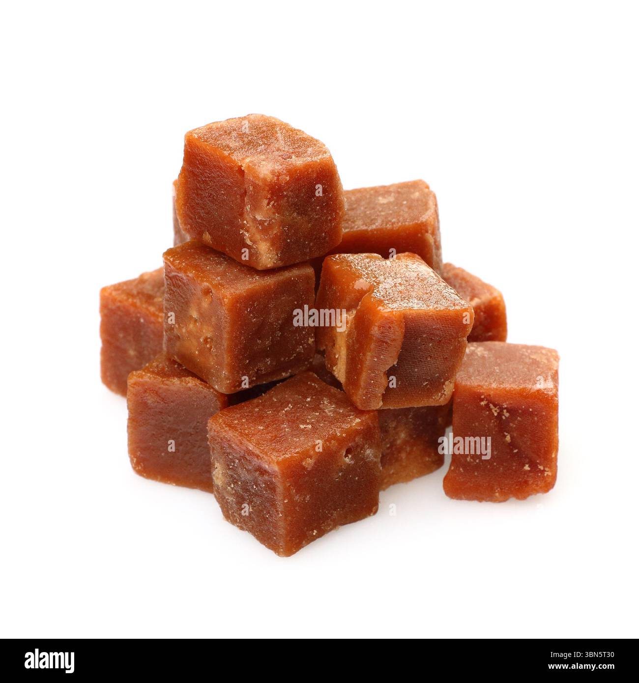brown sugarcane cubes on white background. Stock Photo