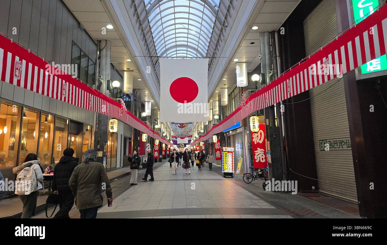 Indoor market visits in Fukuoka Japan with Nippon flag background Stock Photo